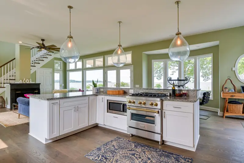 Open kitchen with large island and five-burner gas range