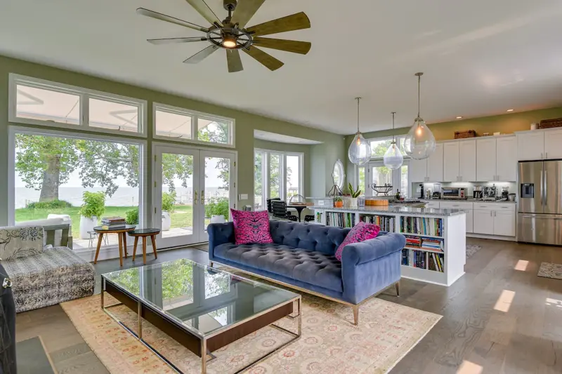 Living room of The Bay House with bay views through wide windows